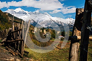 Svan towers in Mestia against mountains, Svaneti, Georgia.