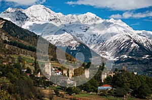 Svan towers in Mestia against mountains, Svaneti, Georgia. photo