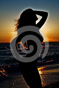 Svelte girl silhouette against the sunset