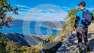 Sveti Ilija - Man with scenic view from mountain summit of Vrmac Sveti Ilija on Kotor bay, Montenegro