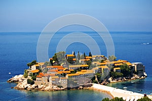 Sveti Stefan island in Budva in a beautiful summer day, Montenegro. Adriatic sea, Montenegro, Europe. Beautiful world of Mediterra photo