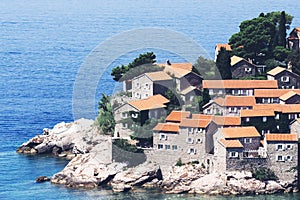 Sveti Stefan island in Budva in a beautiful summer day, Montenegro. Adriatic sea, Montenegro, Europe. Beautiful world of Mediterra photo