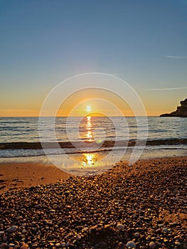 Sveti Stefan - Scenic sunset view from Sveti Stefan Beach at Adriatic Mediterranean Sea, Budva Riviera, Montenegro, Europe