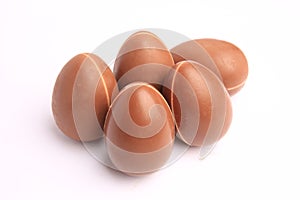 Sveti Vlas, Bulgaria - June 27, 2023: Unwrapped Kinder Surprise Eggs isolated on white