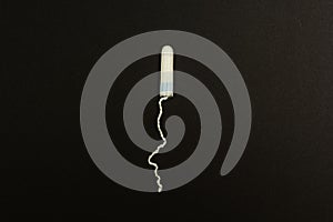 Swab on a black background, with space for text