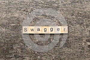 swagger word written on wood block. swagger text on table, concept photo