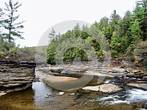 Swallow Falls State Park in the fall in the mountains of Maryland with the creek and waterfalls flowing, cascading in nature