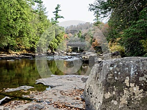 Swallow Falls State Park in the fall in the mountains of Maryland with the creek and waterfalls flowing, cascading in nature