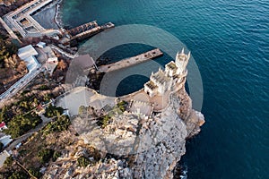 Swallow Nest aerial drone shot, ancient castle on top of mountain cliff near sea Yalta region, Crimea. Beautiful famous palace