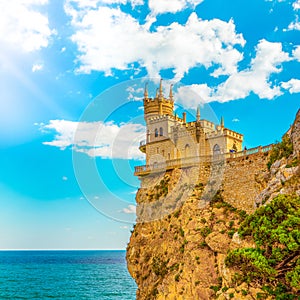 Swallow`s Nest Castle in autumn day with magic sunlight