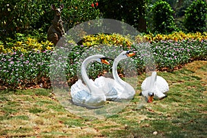 Swan sculpture on meadow