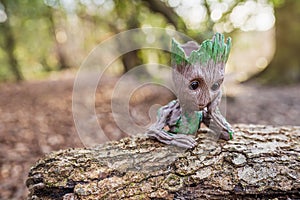 Baby Groot figure pot with forest background