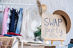 Swap party. Event for exchange of clothes, shoes, accessories. Reduce and reuse photo