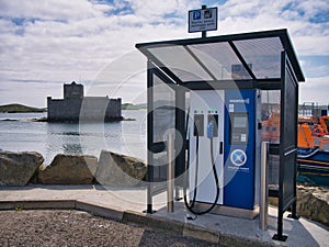 A SWARCO ChargePlace Scotland EV charging point at the harbour of Castlebay on the island of Barra in the Outer Hebrides, Scotland