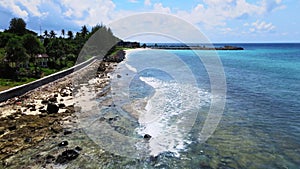 The swashing water over a rocky beach taken with low altitude mode