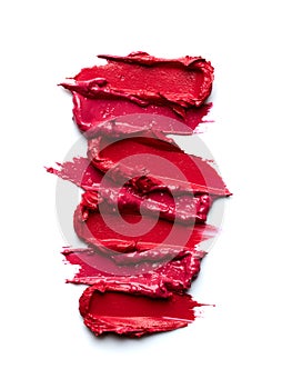 Swatches of red lipstick isolated on white