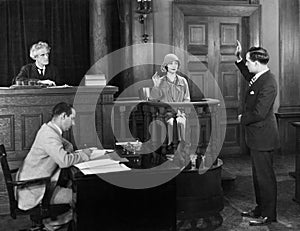 Swearing in witness in courtroom photo