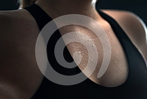 Sweat on skin. Sweaty woman after gym workout, heavy cardio or fat burning training.