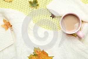 Sweater with coffee and autumn leafs
