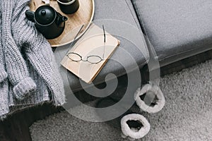 Sweater and reading on sofa