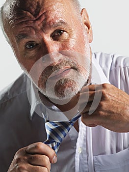 Sweaty Businessman Loosening Tie