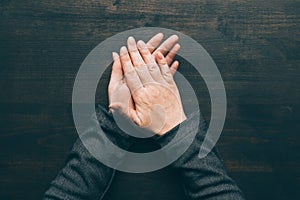 Sweaty palms, top view of female business person hands