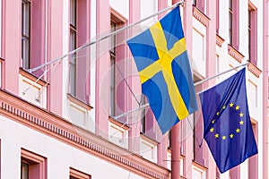 Sweden and euro union flags flags on the wall