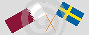 Sweden and Qatar. Crossed Swedish and Qatari flags