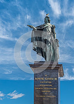 Gustav III statue on pedestal, Skeppsbron quay, Stockholm, Sweden photo