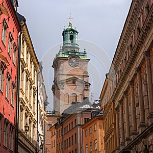 Sweden, Stockholm, on an old street in Gamlastan. The ancient part of the city. The bell tower of the church of St photo