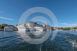 Sweden Stockholm view of Norrmalm district with Taxi and Tour Boats on a sunny day