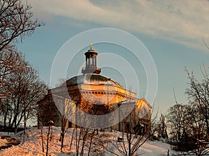 Sweden - winter Stockholm - excellent view on the church on the hill at sunset