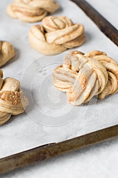 Swedish cinnamon buns dough on a parchment lined baking pan