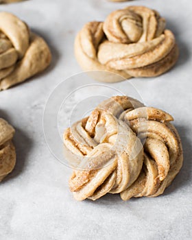 Swedish cinnamon buns dough on a parchment lined baking pan