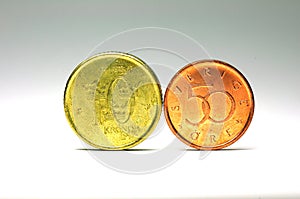 Swedish coins in 10 kronor face value and 50 cent face value