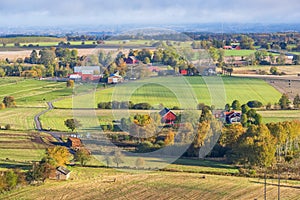 Swedish countryside view with farms and fields in autumn