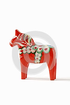 Swedish dalahorse figurine on a white background