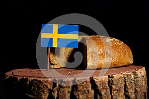 Swedish flag on a stump with bread