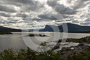 A Swedish Lakeview in the Stora SjÃÂ¶fallet National Park on a cloudy sky. The view is of the luleÃÂ¤lven lake in the park photo