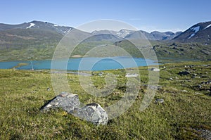 Swedish Lapland landscape. Arctic environment of Scandinavia in warm summer sunny day with blue sky
