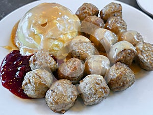 Swedish meatballs with mashed potatoes and gravy.