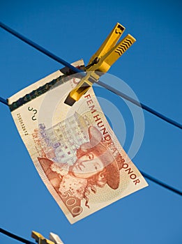Swedish money on clothesline