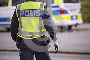 Swedish Police Officer with Reflective Vest and gun