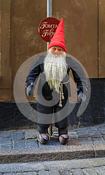 Swedish red hat troll outside a souvenir shop in Gamla Stan in Stockholm, Sweden