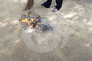 Sweep leaves and burn leaves stack