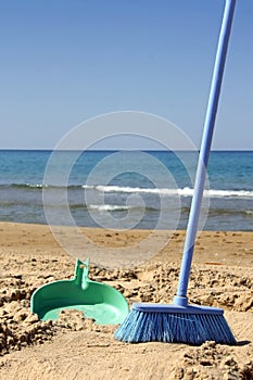 Sweeping the beach (irony) photo
