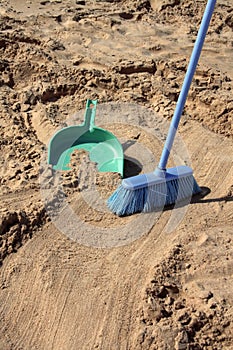 Sweeping the beach (irony) photo