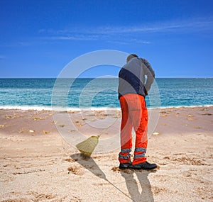 Sweeping the beach