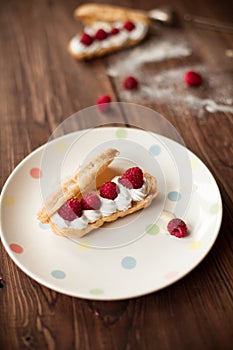 Sweet afters with fresh raspberries on wood table