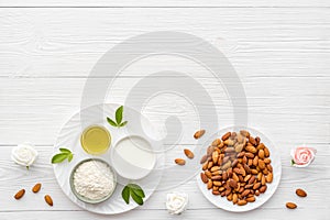 Sweet almond oil and milk with nuts seeds. Healthy food and cosmetic background